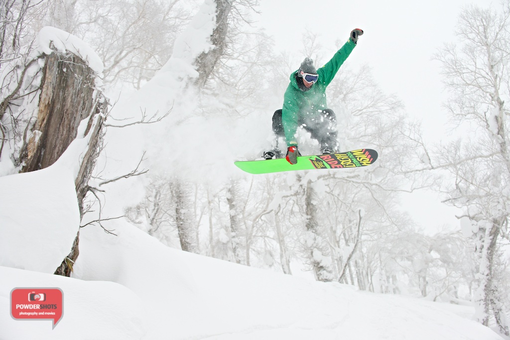 Sam from Niseko Xtreme sending it from a small tree stump