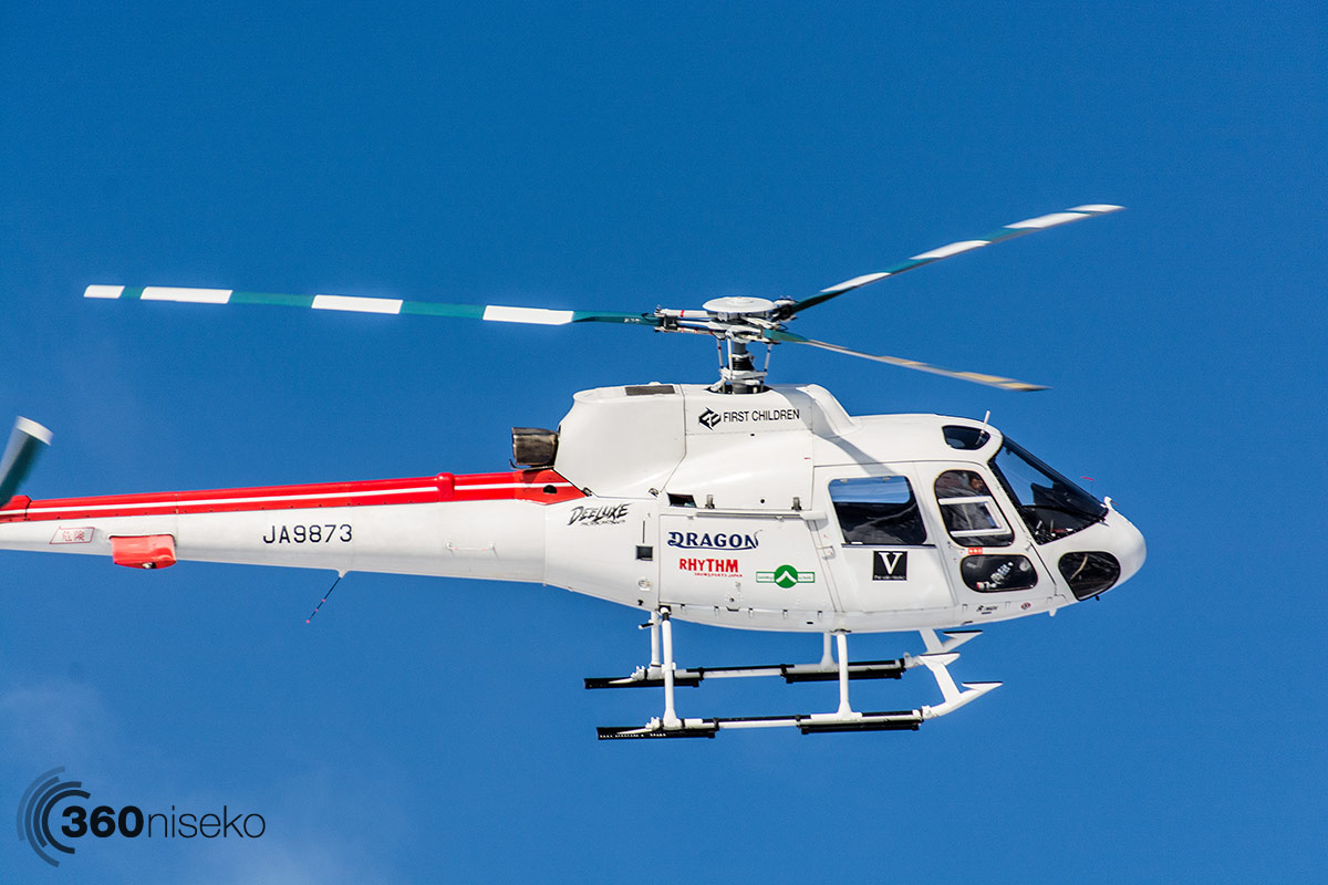 The Hokkaido Backcountry Club chopper coming into land at the Black Diamond Tours office, 13 February 2014